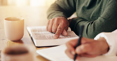 Bible, couple reading and hands writing with prayer, study and spiritual education in home....