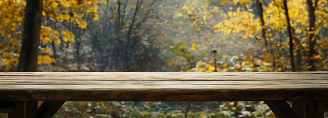Naklejka premium 3. A stunning woodland backdrop during autumn, highlighting a charming wooden table adorned with a soft cloth, offering a perfect blank space for a product display montage