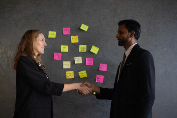 Businessman and businesswoman using problem-solving strategy, showcasing collaboration and success...
