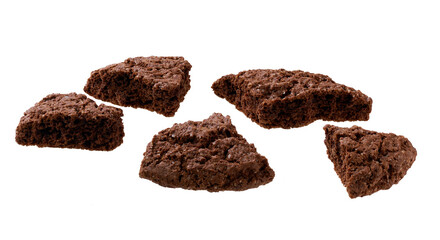 Broken chocolate brownie cookies with cracks isolated on white background.