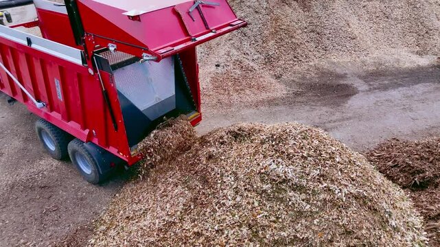 Truck Unloading Wood Chips at Biomass Processing Facility
