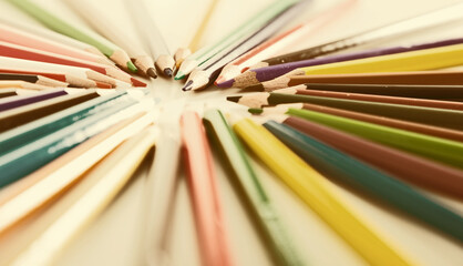 Colored pencils lying in row