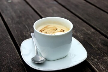 coffee in a white cup on the table