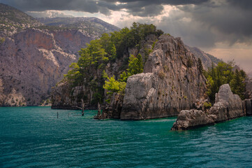 Rocky Coastline with Turquoise Waters and Dramatic Sky