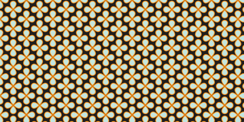 Seamless pattern with simple floral motif in light green and orange border on black background