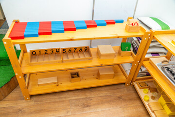 Montessori math shelf with counting rods and number blocks