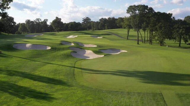 Aerial Drone View of Golf Course Sand Traps and Flag on Green 