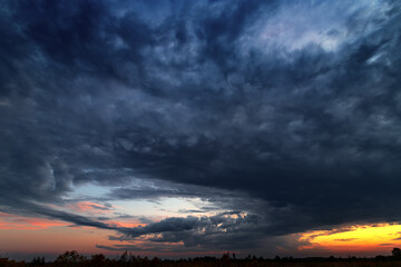 Real majestic sunrise sundown sky background with gentle colorful clouds .