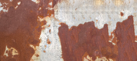 Rust on the iron door for the background. old peeling paint on rusty gates.