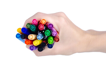 Multicolored markers felt-tip pens in hand on white background isolation