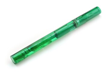 A single green pen lying on a clean white surface, ideal for illustration or design projects