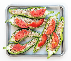 Prepared Stuffed Pepper Halves with Tomato Slices