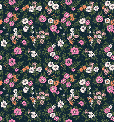 Beautiful floral pattern in small flowers. Small rose, pink and white flowers. Dark blue background. Ditsy print. Floral seamless background. Vintage template for fashion prints. Stock pattern.