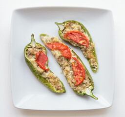 Roasted Stuffed Pepper Halves with Tomato Garnish