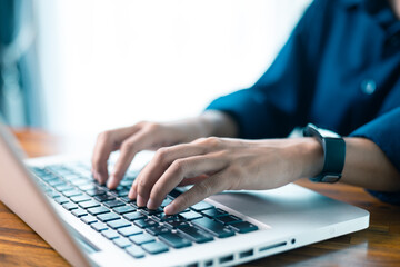 Woman sits at table, using her mobile phone to navigate social media and conduct business through latest technology in cyberspace. social media, table, mobile phone, technology, person, cyberspace.