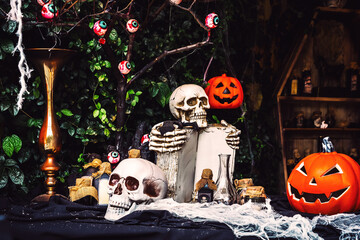Scary evil skull. Outdoor halloween decoration. Halloween skeleton for decoration party. Artificial...