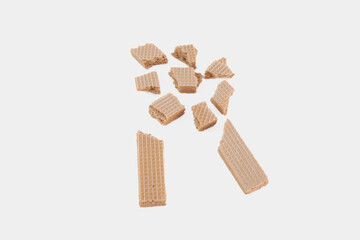 A pile of broken wafers on a white background