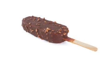 A chocolate bar with nuts on it is sitting on a white background