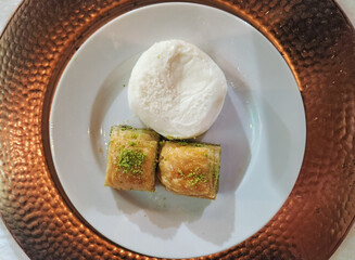 Marash icecream and Gaziantep baklavas served as dessert in a dinner