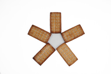 A pile of crackers with holes in them