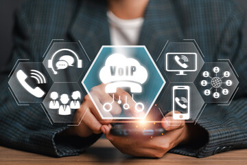 A visual representation of Voice over Internet Protocol (VoIP) technology, showcasing digital communication icons and a smartphone in a professional setting.