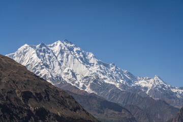 Fototapeta premium Landscape view of summit of mount Rakaposhi in Karakoram mountain range seen from Hunza valley, Karimabad, Gilgit-Baltistan, Pakistan