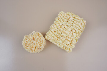 raw instant noodles 
on a brown background