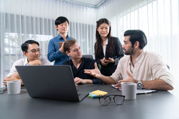 Group of diverse office worker employee working together on strategic business marketing planning in corporate office room. Positive teamwork in business workplace concept. Prudent