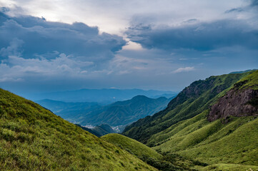 The mountainous landscape of the approaching storm