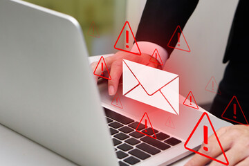 Person using laptop with virtual screen of spam virus email inbox alerts, warning alerts. Email...
