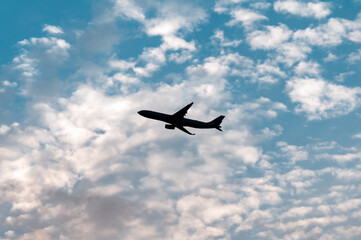 Silhouette of an airplane in the sky