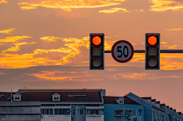 City red traffic light at dusk.