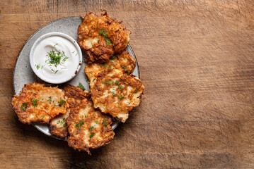 Potato latkes with herbs and sour cream
