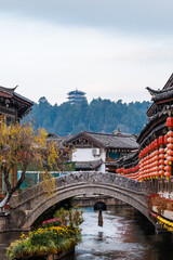 A small bridge over the flowing stream in the Old Town of Lijiang, China
