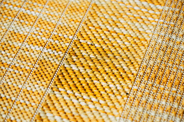 close up of yellow and white patterned fabric