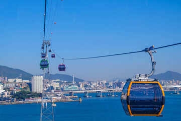 Beautiful landscape of cable car transportation system for tourist traveling at songdo beach, this...