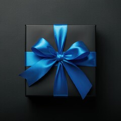 Black gift box with blue ribbon on dark background, black friday sale concept, top view
