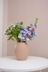 An Elegant Floral Arrangement Displayed Beautifully in a Minimalist Decorative Vase