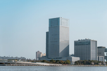 Fototapeta premium Urban modern commercial buildings located by the river.