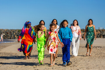 Torres Strait Islander multi-generation family walking at the beach