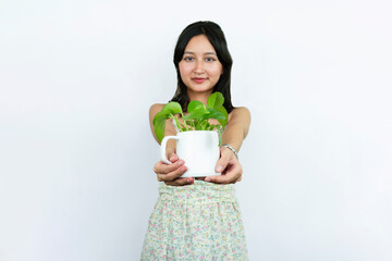 Young Asian Female Gardener Florist With Indoor Garden Plants