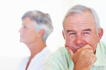 Sofa, senior man and thinking after conflict for fight, misunderstanding and upset in lounge. Angry couple, male person and woman on couch for cheating, affair and husband with divorce ideas at home