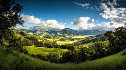 Obraz premium Mountain landscape with green meadows and blue sky 