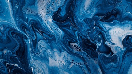 Obraz premium An abstract swirl of deep blue and white, creating a mesmerizing ocean-like pattern with fluid movement and texture.