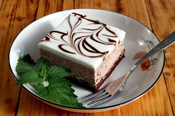 There is a large piece of cake on the plate.