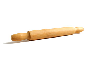 Wooden kitchen rolling pin lies on a white background.	