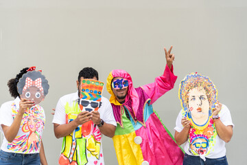 Group Posing with Colorful Masks and Costumes for Carnival