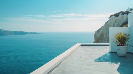 Fototapeta premium Terrace with sea view in Santorini style, featuring white walls and concrete floor, overlooking the cliff and ocean, with a distant island in clear midday sun.