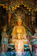 Stone statue of cross-legged Bodhisattva in Cave 18 of Yungang Grottoes, Datong, Shanxi Province