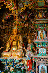 Stone statue of cross-legged Bodhisattva in Cave 18 of Yungang Grottoes, Datong, Shanxi Province
